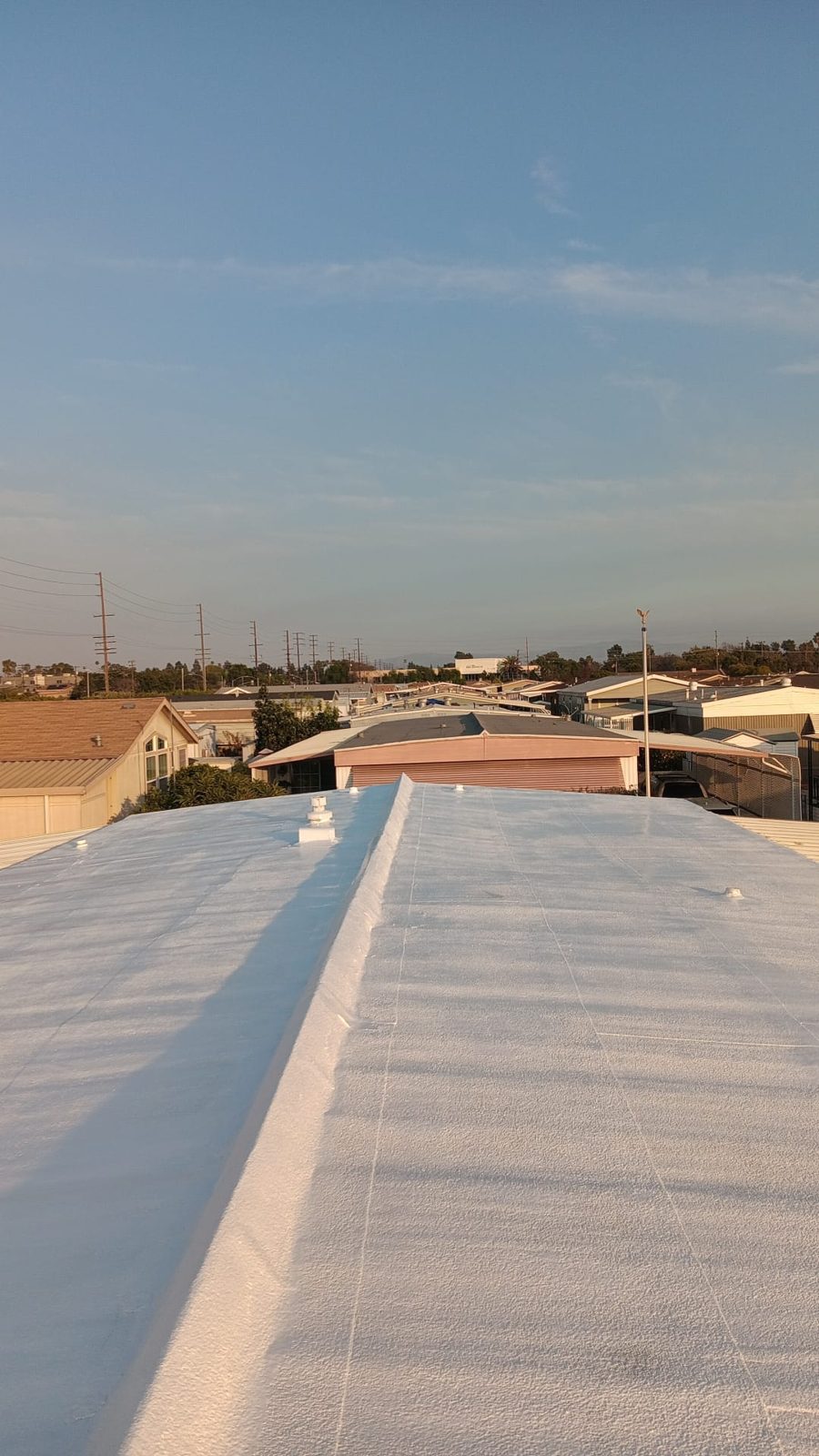 flat roof with white reflective coating on a home in Alhambra, California — a Samuel Roofing Inc. job photo
