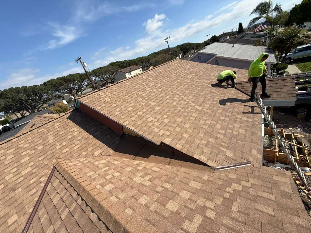 Samuel Roofing Inc. crew working on an architectural shingle roof in Downey, California