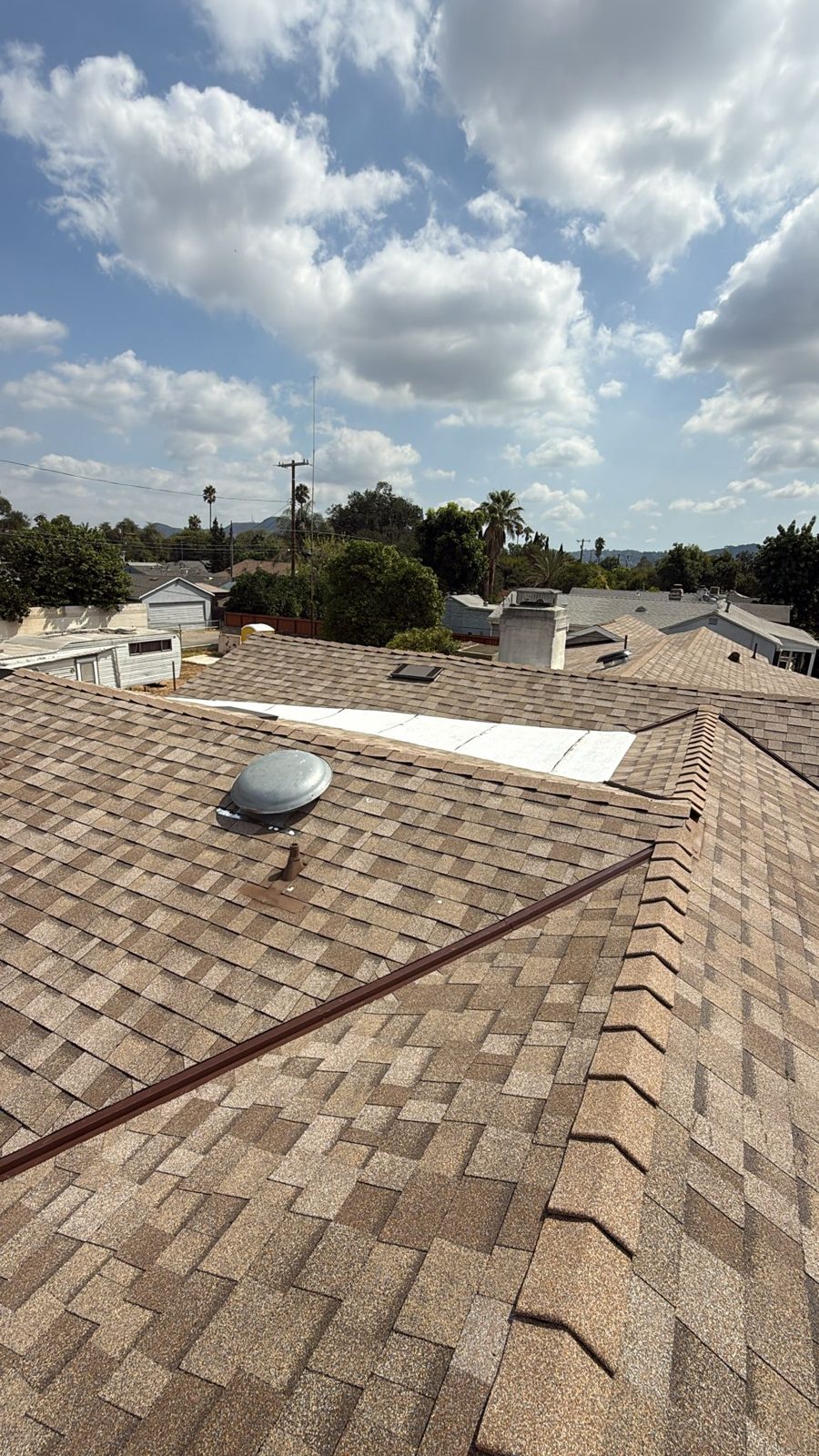 flat roof with white reflective coating on a home in Hollywood Hills, California — a Samuel Roofing Inc. job photo