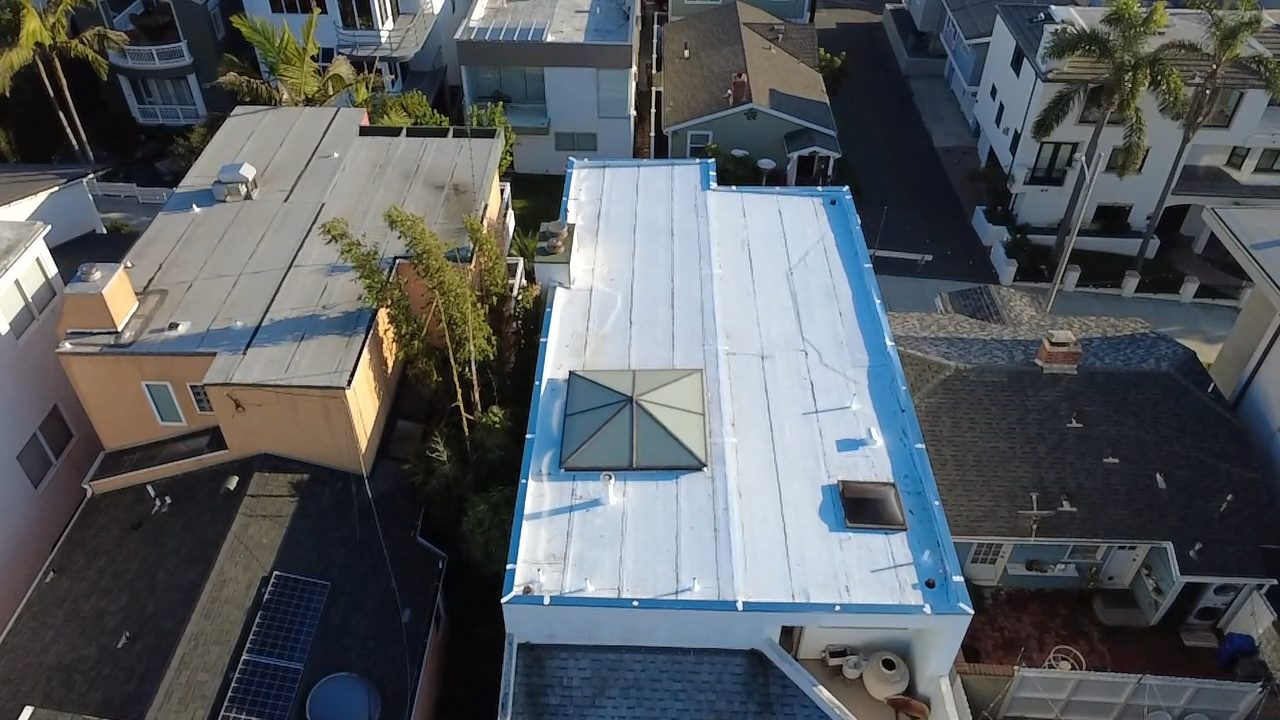 flat roof with white reflective coating on a home in Manhattan Beach, California — a Samuel Roofing Inc. job photo