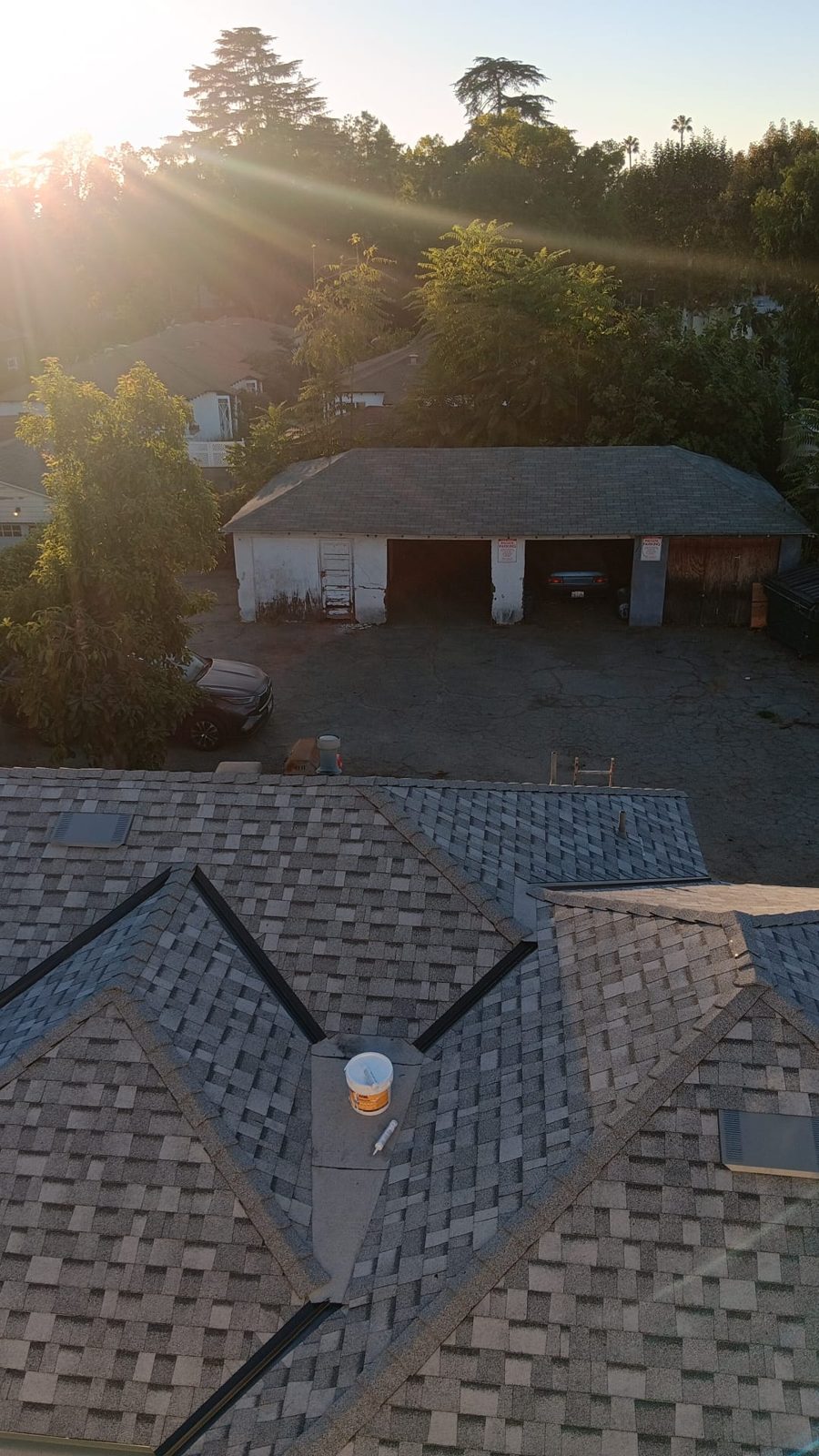 Drone photo of an architectural shingle roof in Pasadena, California at dusk — a Samuel Roofing Inc. job photo