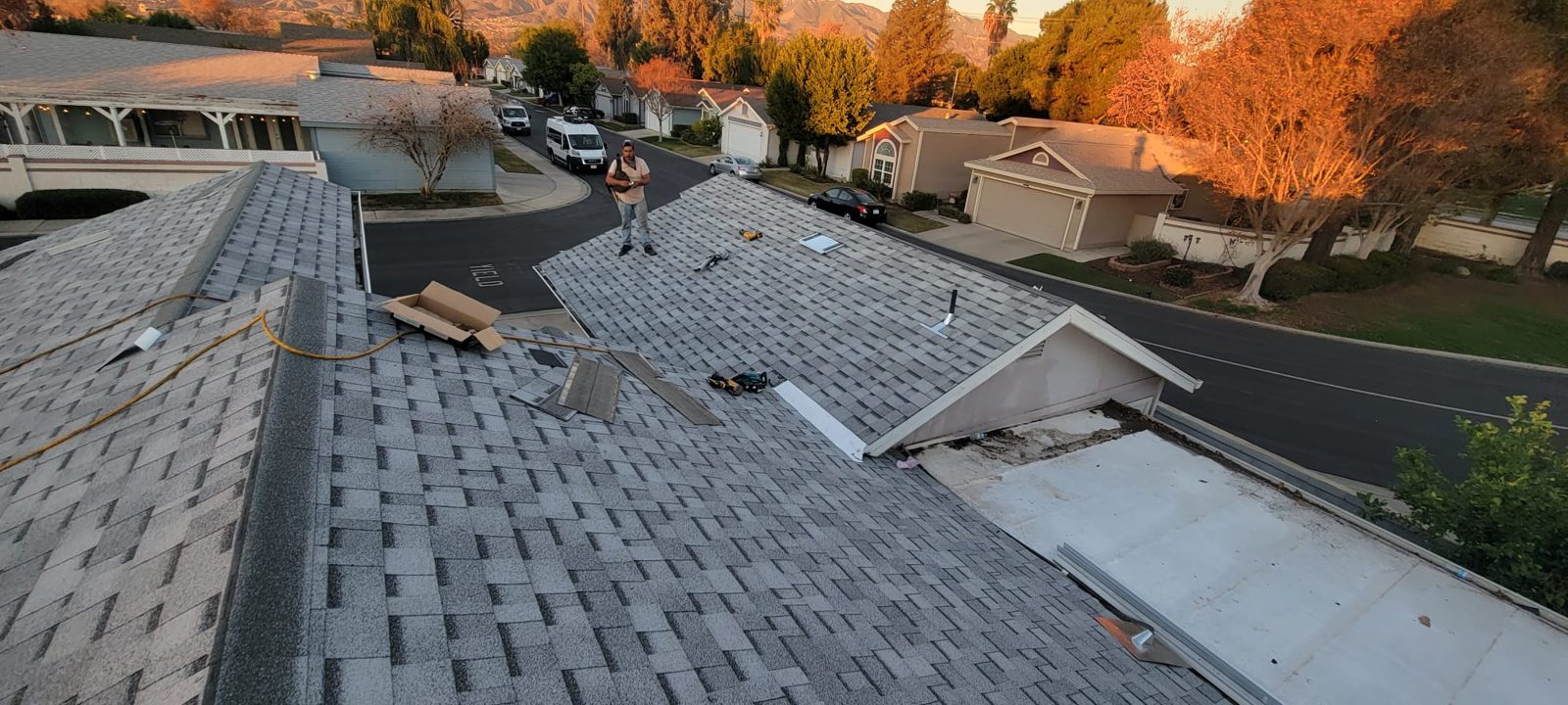 Samuel Roofing Inc. crew finishing an architectural shingle roof (portfolio photo)