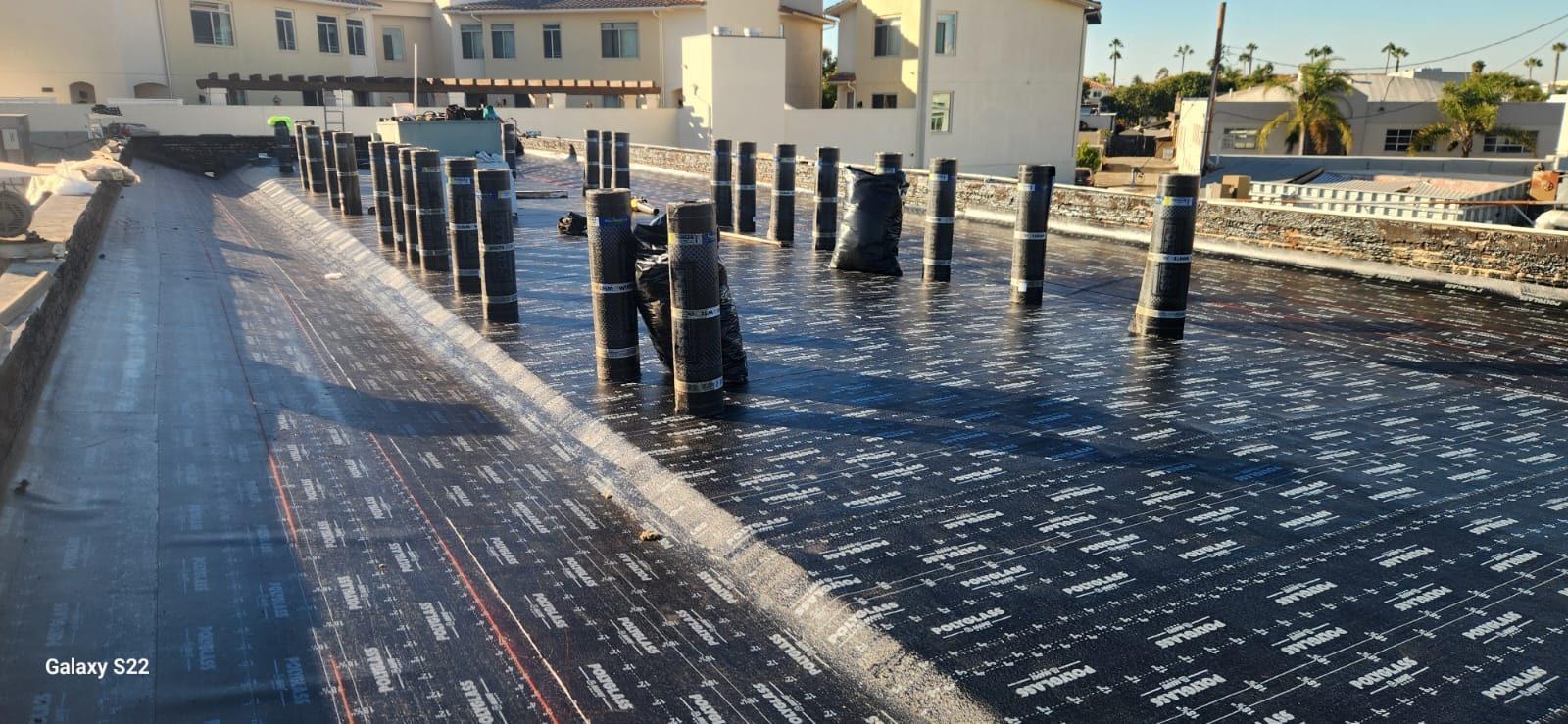 flat roof with white reflective coating on a home in Torrance, California — a Samuel Roofing Inc. job photo